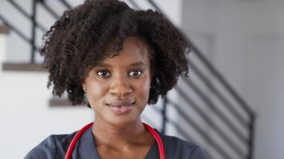Nurse in gray scrubs with stethoscope