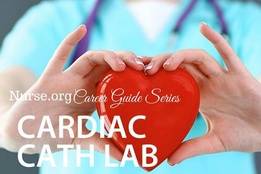 Nurse holding red heart to camera