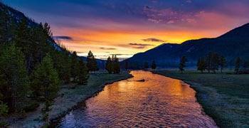 River going through valley at dusk in Wyoming